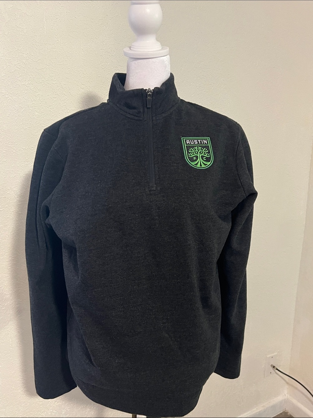 Antigua Black Quarter-Zip Sweater with Green Austin Crest